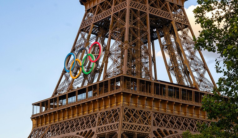 How do the Olympic Organizing Committee and gold medalists protect international trademarks?